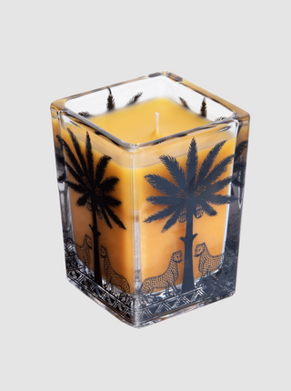 Square glass candle with palm tree and leopard design on a white background