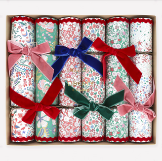 Decorative crackers with colorful bows in a box
