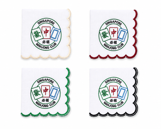 Four scalloped cocktail napkins with a logo and text of Singapore Mahjong Club on a white background.