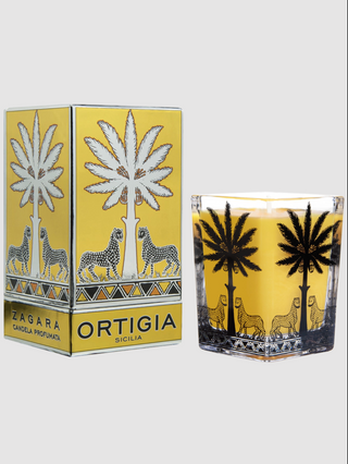 Candle with palm tree design and packaging featuring 'Zagara Ortigia Sicilia' branding.