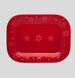 Red rectangular platter with snowflake patterns on a light gray background