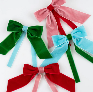Set of colorful velvet bows on a white background