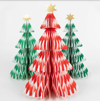 Three paper Christmas trees in red, green, and white on a white background