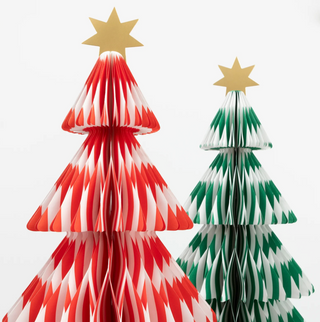 Two paper Christmas trees, one red and white, the other green and white, on a white background.