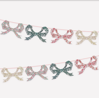 Decorative ribbon bow banner on a white background