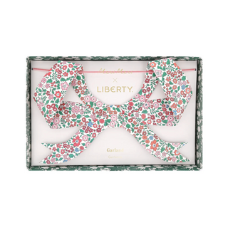 Floral letter 'Q' in a Liberty of London box on a white background