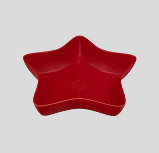 Red star-shaped bowl on a light gray background