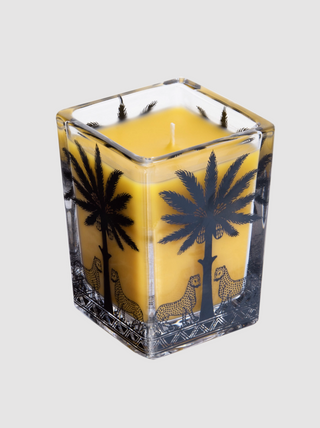 Square glass candle with palm tree and leopard design on a white background