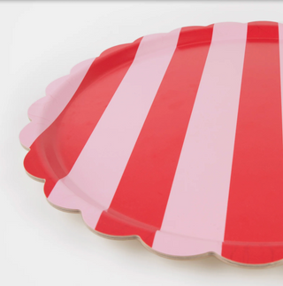 red and pink striped round tray on a white background