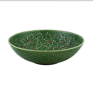 Green ceramic bowl with holly design on a white background