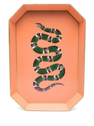 Decorative tray with a green snake design on a peach background